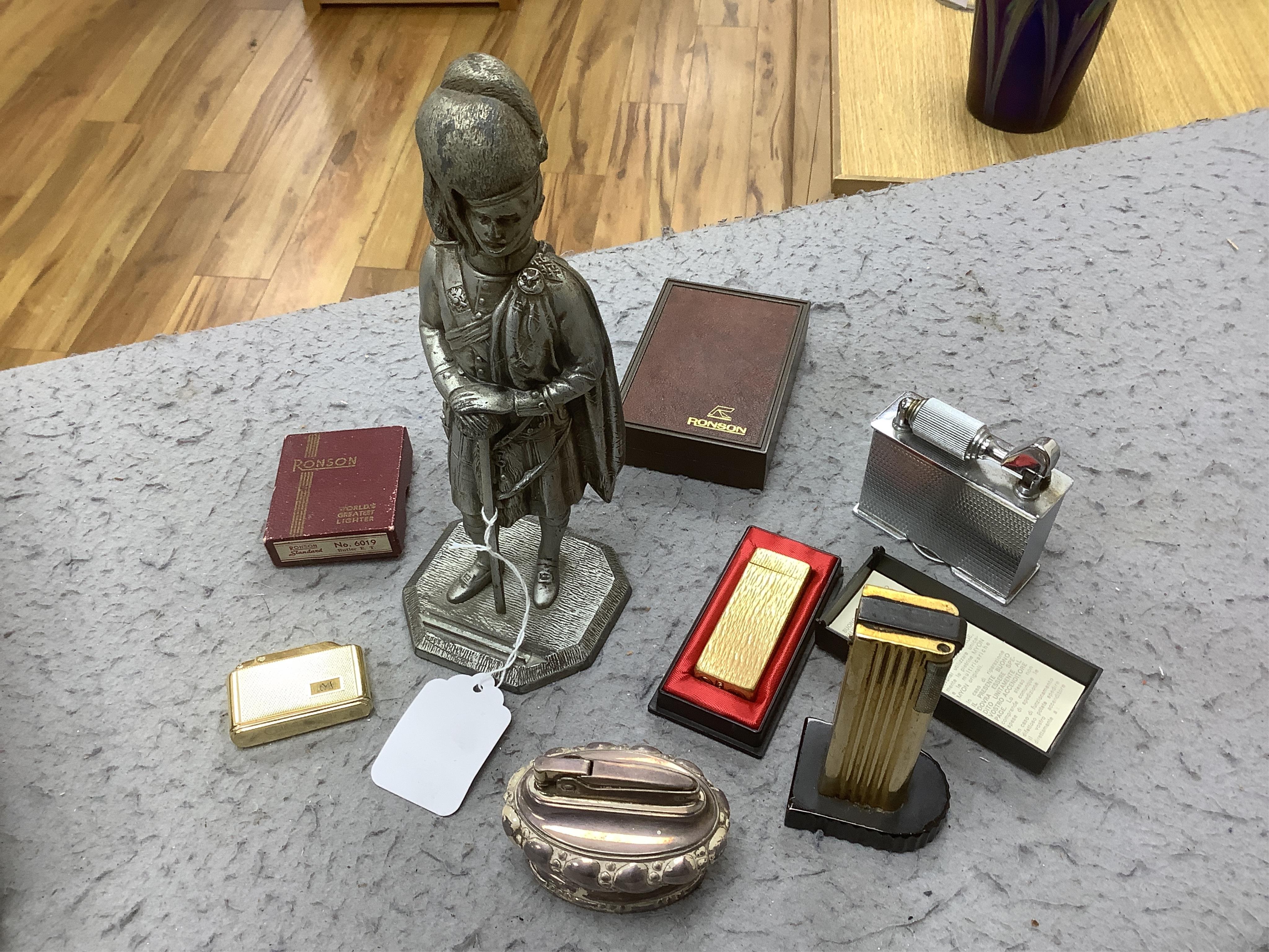 A collection of assorted cigarette lighters, including a large figural lighter, largest 23cm high. Condition - variable